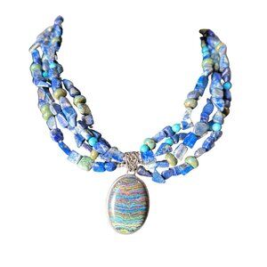 Custom blue lapis necklace with rainbow calsilica pendant